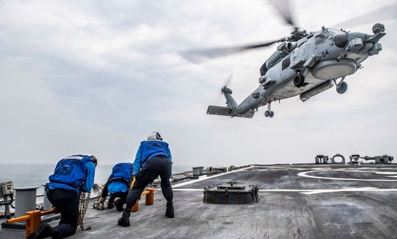 An MH-60R Sea Hawk helicopter prepares to land aboard USS John S. McCain (DDG 56). Image credit: U.S. Navy / Taylor DiMartino via Flickr, CC BY 2.0
