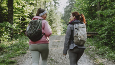 Two women hiking with backpacks
