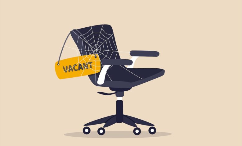 Labor shortage, worker needed not enough skill staff to fill in job vacancy, help wanted or employment demand concept, office chair with sign vacant covered by spider web metaphor of labor shortage.