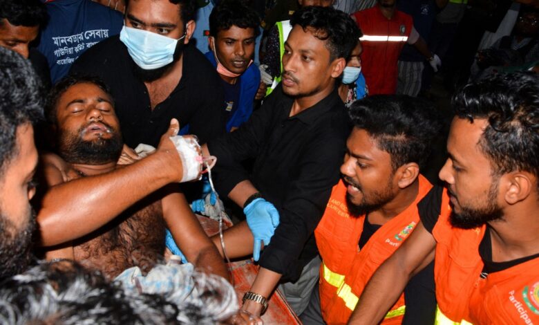 An injured victim is brought to a hospital after a massive fire broke out in an inland container depot at Sitakund, near the port city Chittagong, Bangladesh, June 5, 2022. REUTERS/Stringer NO RESALES. NO ARCHIVES