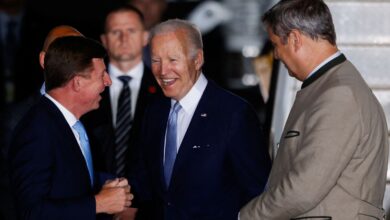 U.S. President Joe Biden is greeted as he arrives at Franz-Josef-Strauss airport in Munich ahead of the G7 summit, which will take place in the Bavarian alpine resort of Elmau Castle, Germany, June 25, 2022. REUTERS/Michaela Rehle