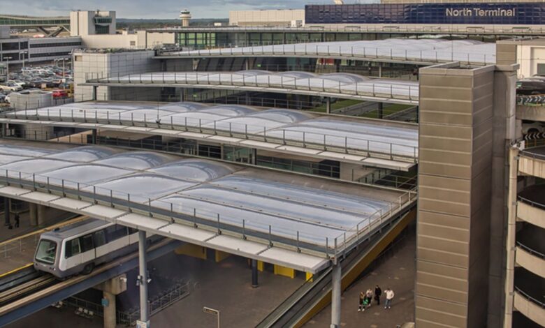 London Gatwick Airport North Terminal, Sussex, England, UK. August 2020, early morning. Aerial view of the North Terminal at Gatwick Airport showing terminal buildings, car park and shuttle train departing. Pic: iStock
