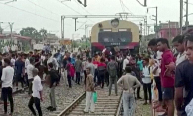 Demonstrators block a train in Jehanabad
