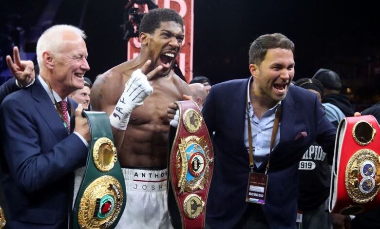 Anthony Joshua with Eddie Hearn (right) and Barry Hearn (2nd left)