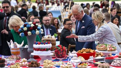 Prince Charles and his wife Camilla, Duchess of Cornwall, look at decorations at The Oval cricket ground as they attend a Big Jubilee Lunch