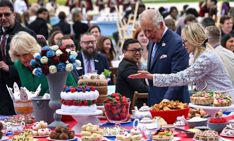 Prince Charles and his wife Camilla, Duchess of Cornwall, look at decorations at The Oval cricket ground as they attend a Big Jubilee Lunch