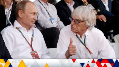 Formula One commercial supremo Bernie Ecclestone (R) talks with Russia's President Vladimir Putin