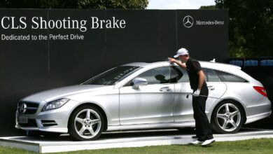 Stuart Manley of Wales pats a Mercedes Benz car making a hole-in-one on the 3rd tee during day three of the World Cup of Golf at Royal Melbourne Golf Course on November 23, 2013 in Melbourne, Australia