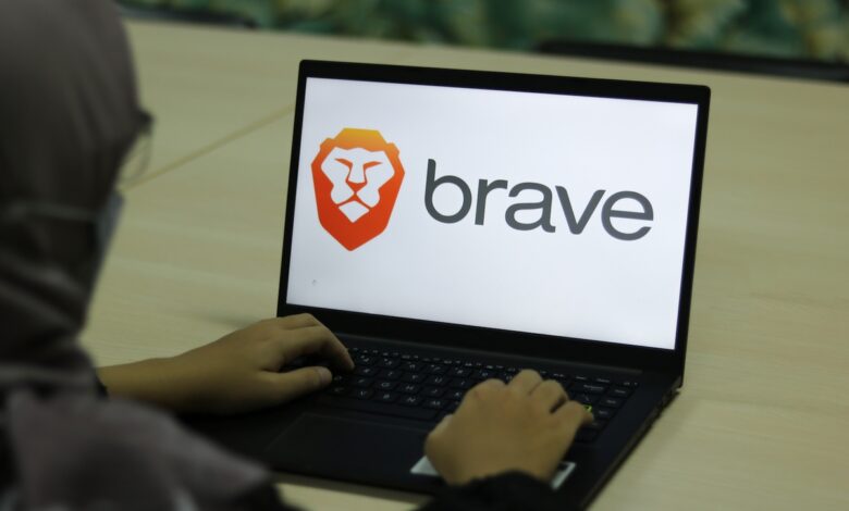 Laptop featuring Brave logo.