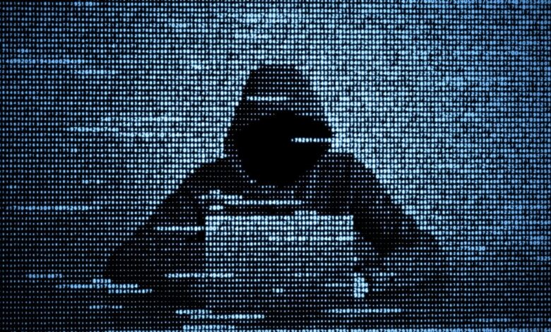 Hacker in data security concept. Hacker using laptop. Hacking the Internet. Cyber attack.