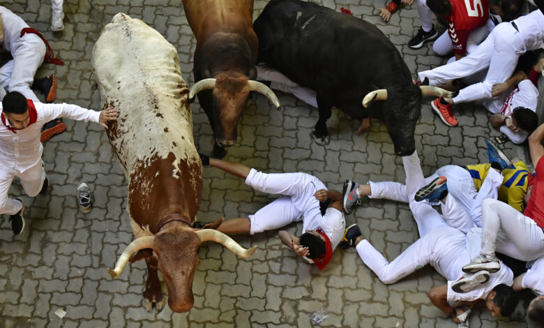 Three athletes race in the tense 5th Pamplona bull run: NPR
