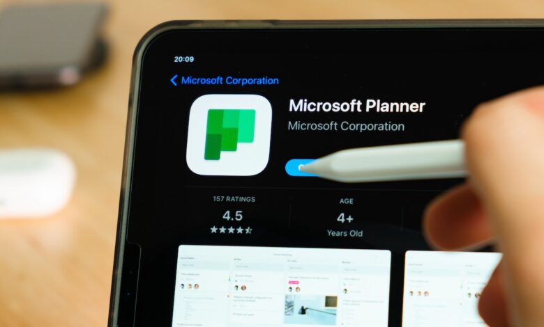 Microsoft Planner logo shown by apple pencil on the iPad Pro tablet screen. Man using application on the tablet. December 2020, San Francisco, USA.