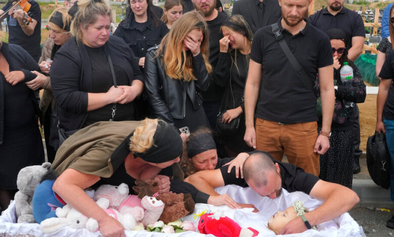 Family members Mourning a 4-year-old girl killed in a Russian missile attack