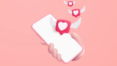 3d heart and love with wings is flying on mobile phone in holding hand. social media online emoji icon platform concept, communication on application. 3d heart with wings vector render illustration