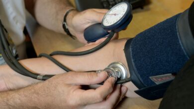 File photo dated 10/09/14 of a doctor checking a patient's blood pressure. High blood pressure could be treated with an injection every six months instead of a daily tablet as part of a new trial into the condition.