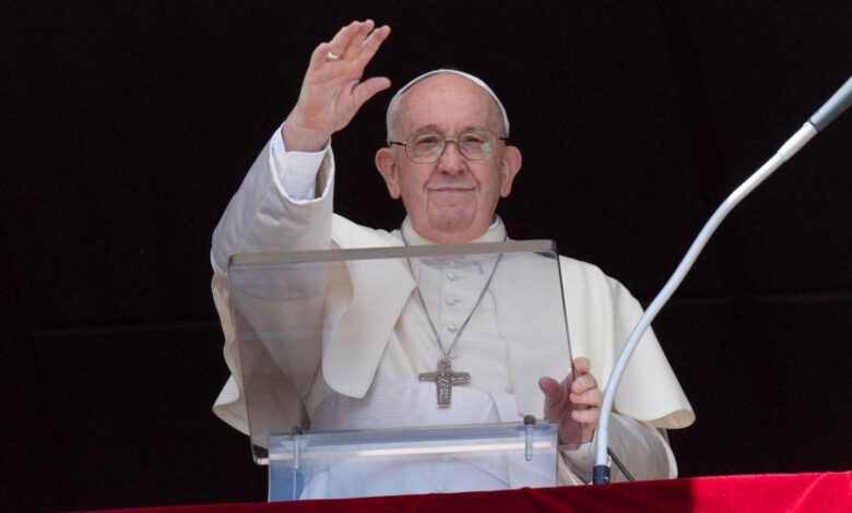 Pope Francis waving at the Vatican
