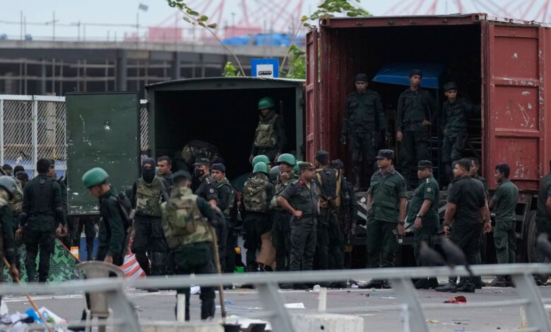 Army soldiers clear anti-government protest camps after an eviction of protesters from the presidential secretariat premise in Colombo, Sri Lanka, Friday, July 22, 2022. (AP Photo/Eranga Jayawardena)
