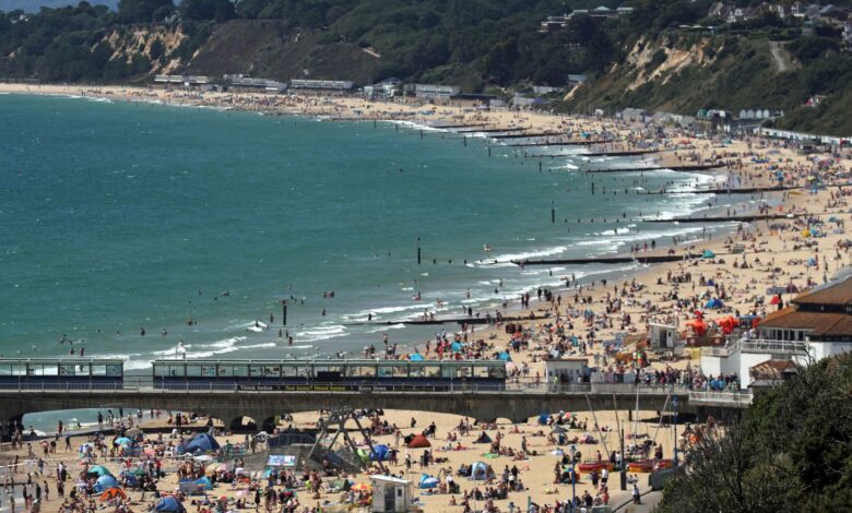 PABEST People on the beach at Bournemouth as the hot weather continues.