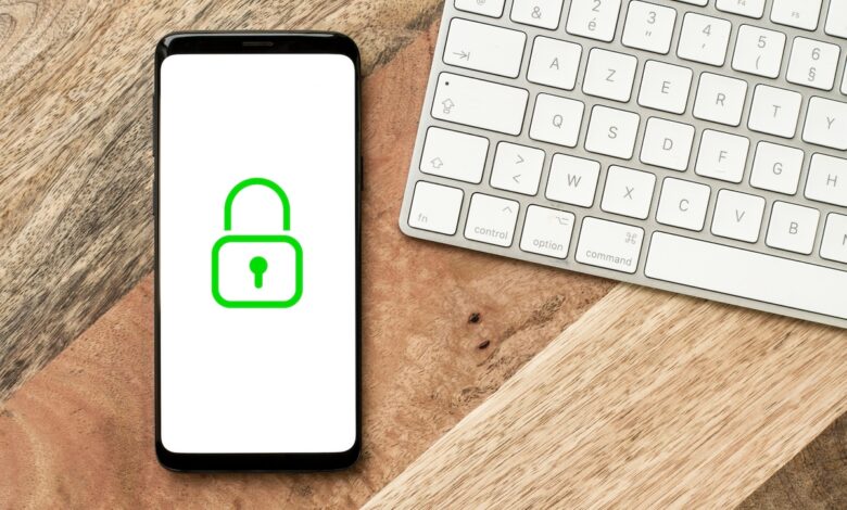 Green padlock icon on a smartphone screen, web and network protection, security and anonymity symbol