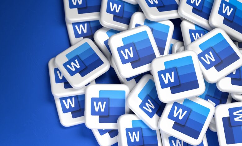 Logos of the Microsoft Office component Word on a heap. Copy space. Web banner format.