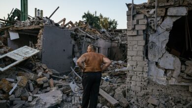 Oleksandr Shulga looks at his destroyed house following a missile strike in Mykolaiv, southern Ukraine, on August 29, 2022,