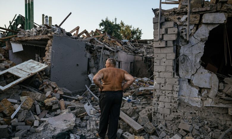 Oleksandr Shulga looks at his destroyed house following a missile strike in Mykolaiv, southern Ukraine, on August 29, 2022,