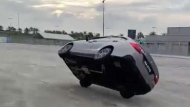 Stunt driver Faidzal Alang tries to set the record for the first car to drive Sepang around on two wheels using Proton Saga
