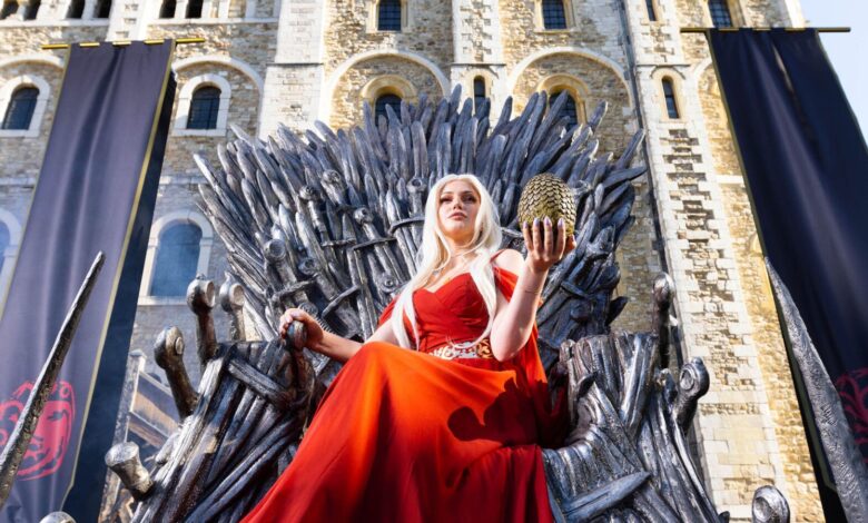 Cosplayer and super fan Sophia sits on the Iron Throne outside the Tower of London to mark the launch of the Game of Thrones prequel