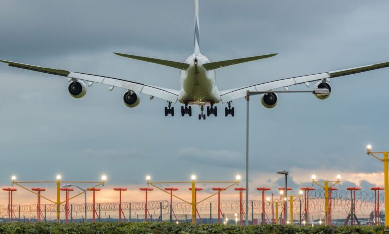 Airplane landing at Heathrow airport in London stock photo