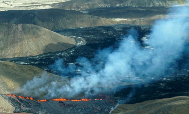 A aerial shot of activity from the Fagradalsfjall volcano in Iceland on Wednesday Aug. 3, 2022, which is located 32 kilometers (20 miles) southwest of the capital of Reykjavik and close to the international Keflavik Airport. Authorities in Iceland say a volcano in the southwest of the country is erupting just eight months after its last eruption officially ended. (AP Photo/Ernir Snaer)