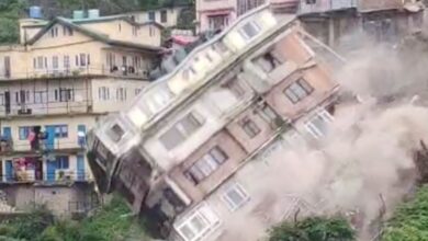 An evacuated building collapses due to a landslide in Shimla, Himachal Pradesh, India