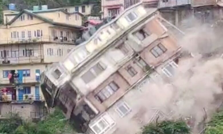An evacuated building collapses due to a landslide in Shimla, Himachal Pradesh, India