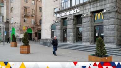 FILE PHOTO: A man walks past a closed McDonald's restaurant in central Kyiv, Ukraine February 25, 2022. REUTERS/Valentyn Ogirenko/File Photo