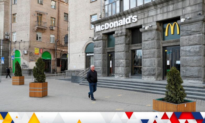 FILE PHOTO: A man walks past a closed McDonald's restaurant in central Kyiv, Ukraine February 25, 2022. REUTERS/Valentyn Ogirenko/File Photo
