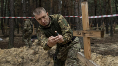 Ukraine's President says a new mass grave was found near a recaptured city: NPR