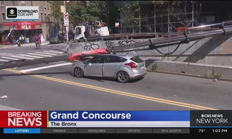 Construction crane falls on car in NYC, driver okay