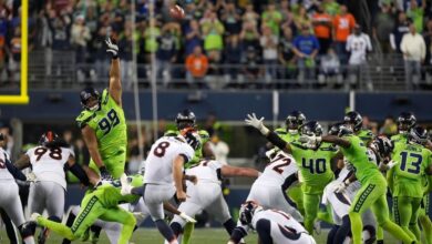 Denver Broncos' Russell Wilson agrees with the call to try to hit the 64-yard goal to close the game