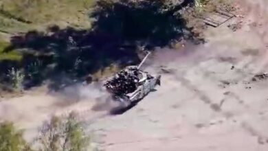 Russian tank flees the battle, rushes to the tree stump at full speed (Video)