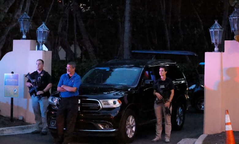 Armed Secret Service agents stand outside an entrance to former President Donald Trump's Mar-a-Lago estate, late Monday, Aug. 8, 2022, in Palm Beach, Fla. Trump said in a lengthy statement that the FBI was conducting a search of his Mar-a-Lago estate and asserted that agents had broken open a safe. (AP Photo/Terry Renna)
