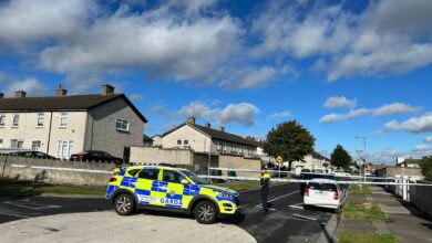 Scene showing Irish police in Tallaght, Dublin where three sisters were found dead
