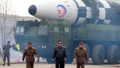 North Korean leader Kim Jong Un walks away from what state media report is a "new type" of intercontinental ballistic missile (ICBM) in this undated photo released on March 24, 2022 by North Korea's Korean Central News Agency (KCNA).