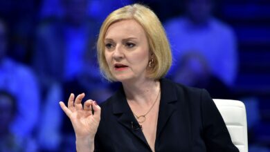 Liz Truss addresses Conservative Party members during a Conservative leadership election hustings at the NEC, Birmingham, England, Tuesday, Aug. 23, 2022. (AP Photo/Rui Vieira)