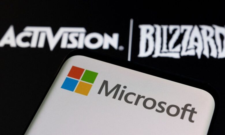 Microsoft logo is seen on a smartphone placed on displayed Activision Blizzard logo in this illustration taken January 18, 2022. REUTERS/Dado Ruvic/Illustration/File Photo