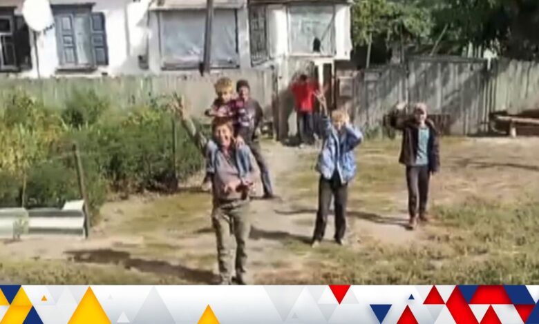 Ukrainian troops greet civilians in Kharkiv Oblast as part of the counteroffensive