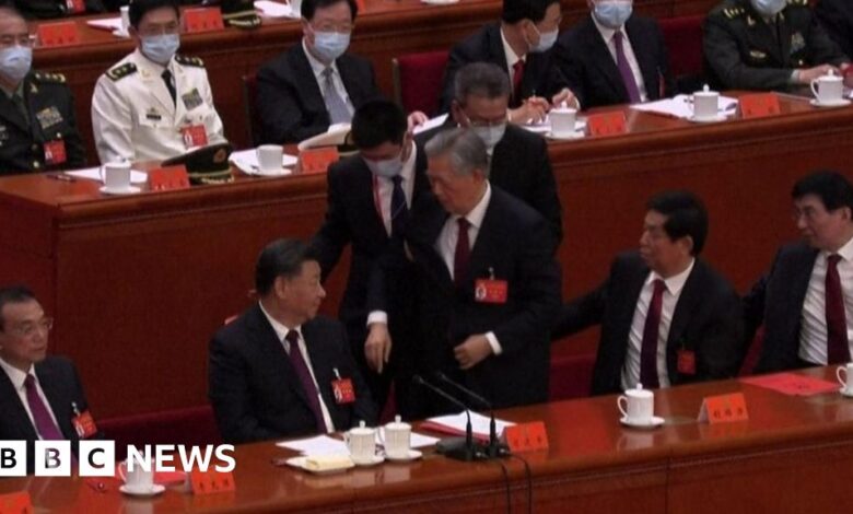 Hu Jintao: Former Chinese leader leads out of Party Congress meeting