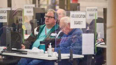 Tabulators process ballots at the Maricopa County Tabulation and Election Center in Phoenix, on Saturday.
