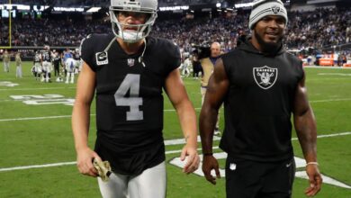 Derek Carr tries to hold back tears on the podium after Raiders lose to Colts