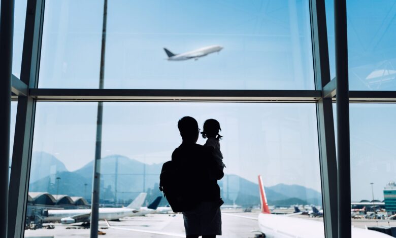 Father and daughter at an airport
