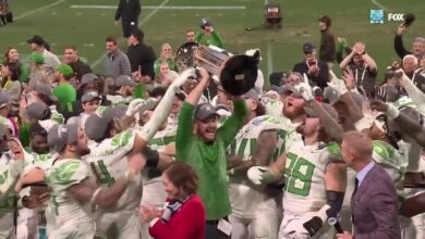 Oregon Ducks hoist the trophy after defeating UNC to win the Holiday Bowl