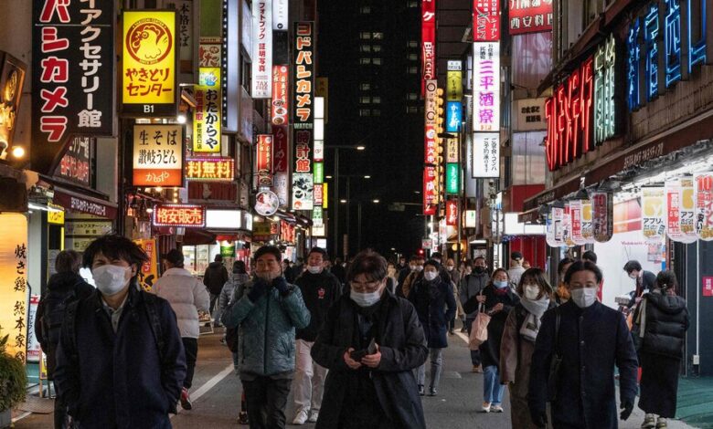 Crowded with tourists, Japan returns to economic growth